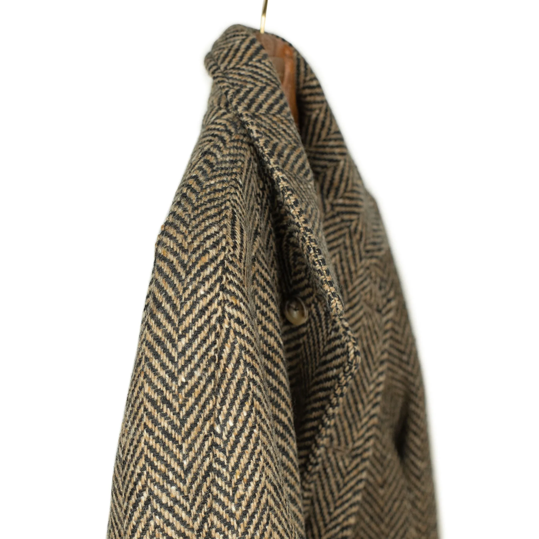 Belted balmacaan coat in handloomed Donegal oatmeal-black herringbone tweed