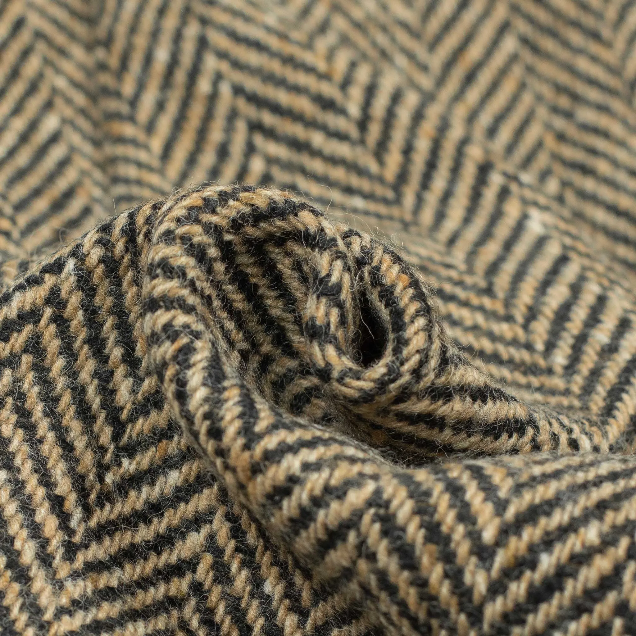 Belted balmacaan coat in handloomed Donegal oatmeal-black herringbone tweed